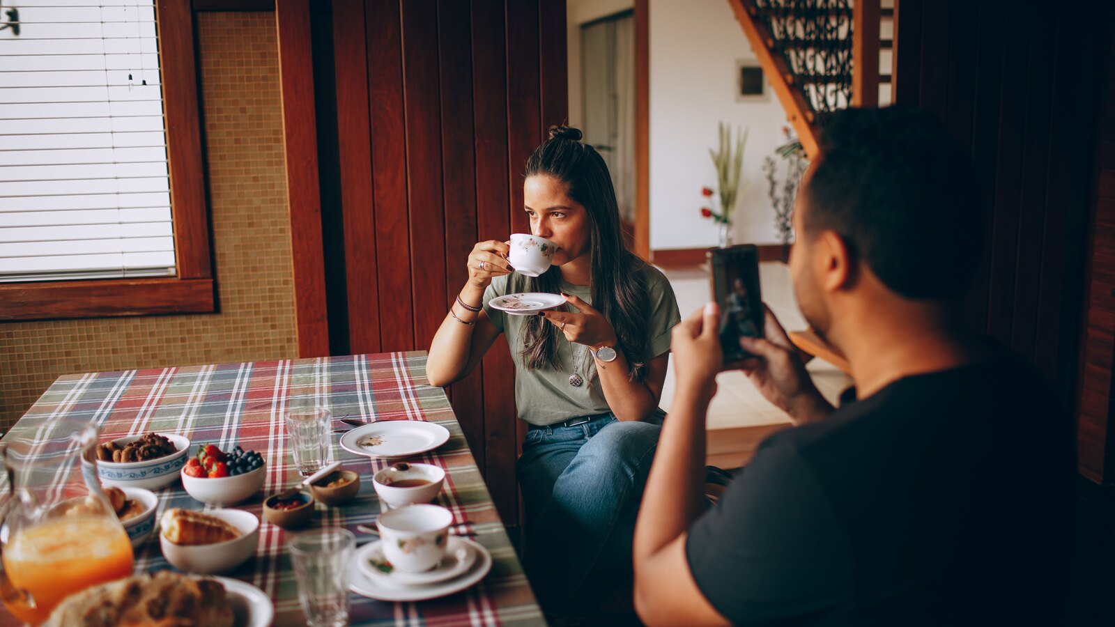 Members sharing breakfast at a long table